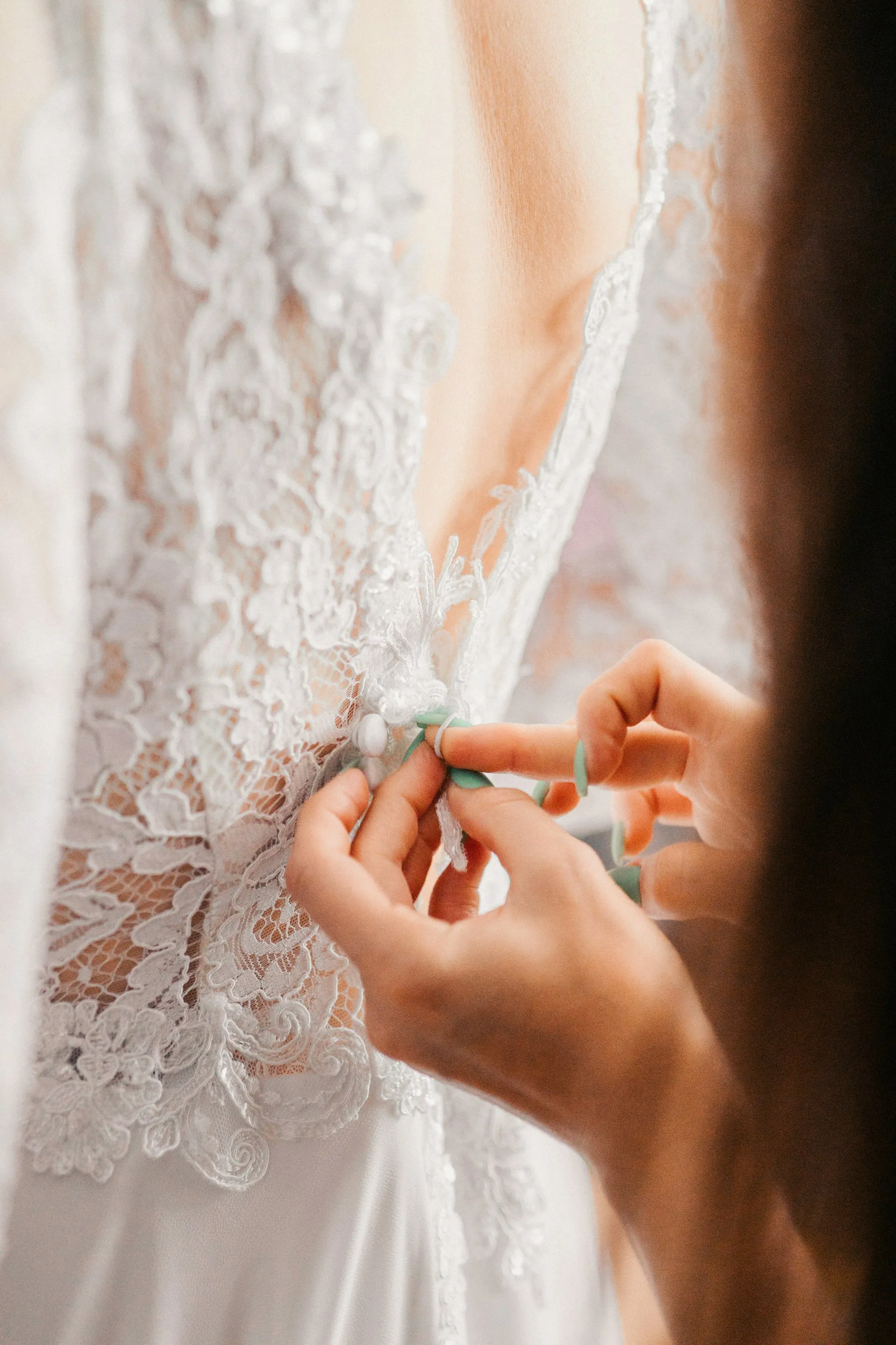 White wedding gown on a hanger ready for alterations